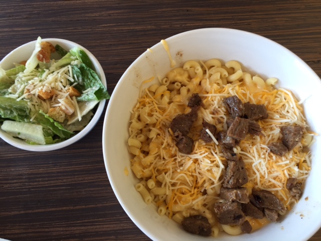 The Wisconsin Mac&Cheese with steak added with a Caesar salad. Photo Credit: Sarah Goetze